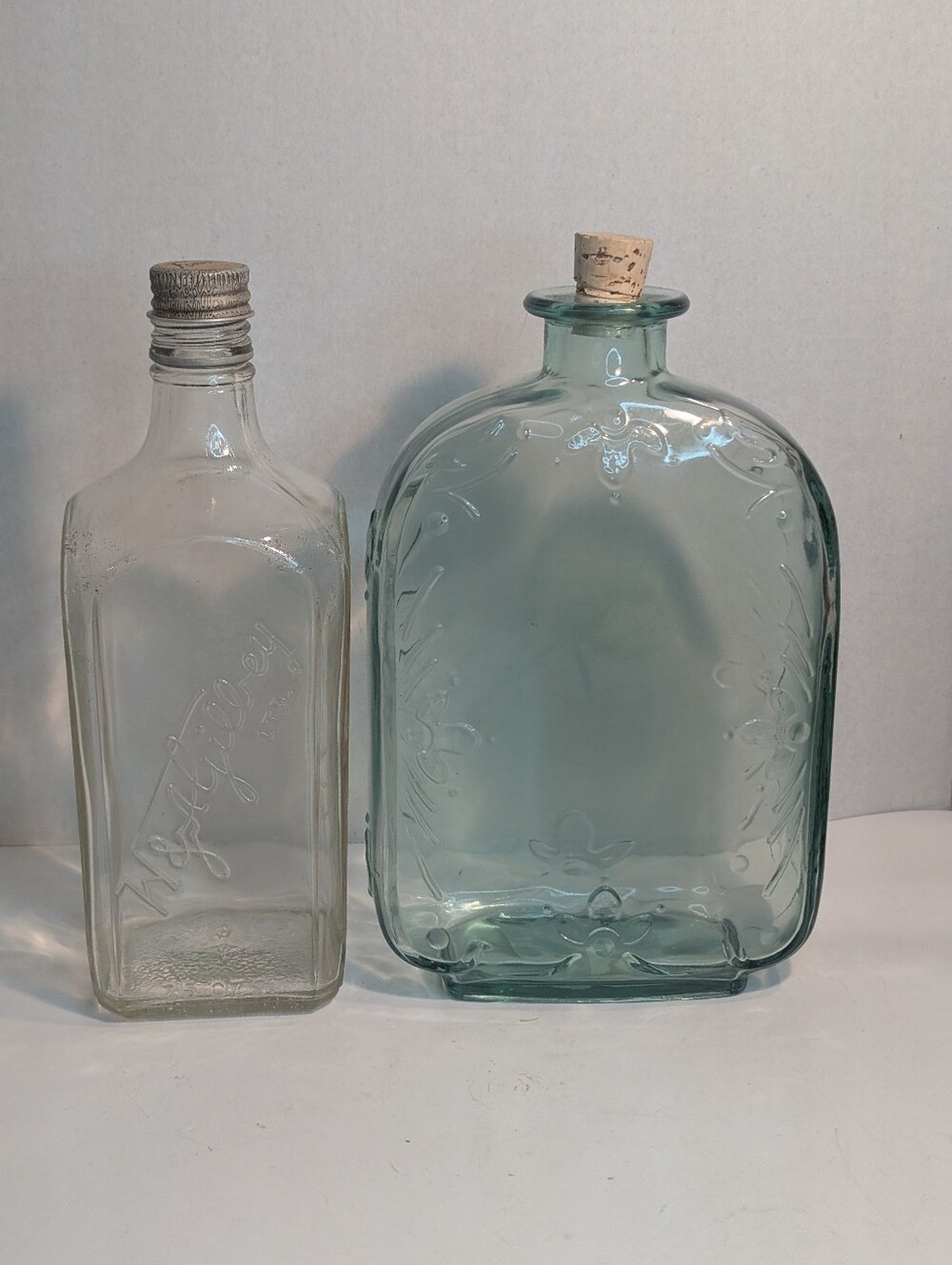 Two Vintage Bottles For Decoration.  Aqua Glass And Clear Glass.